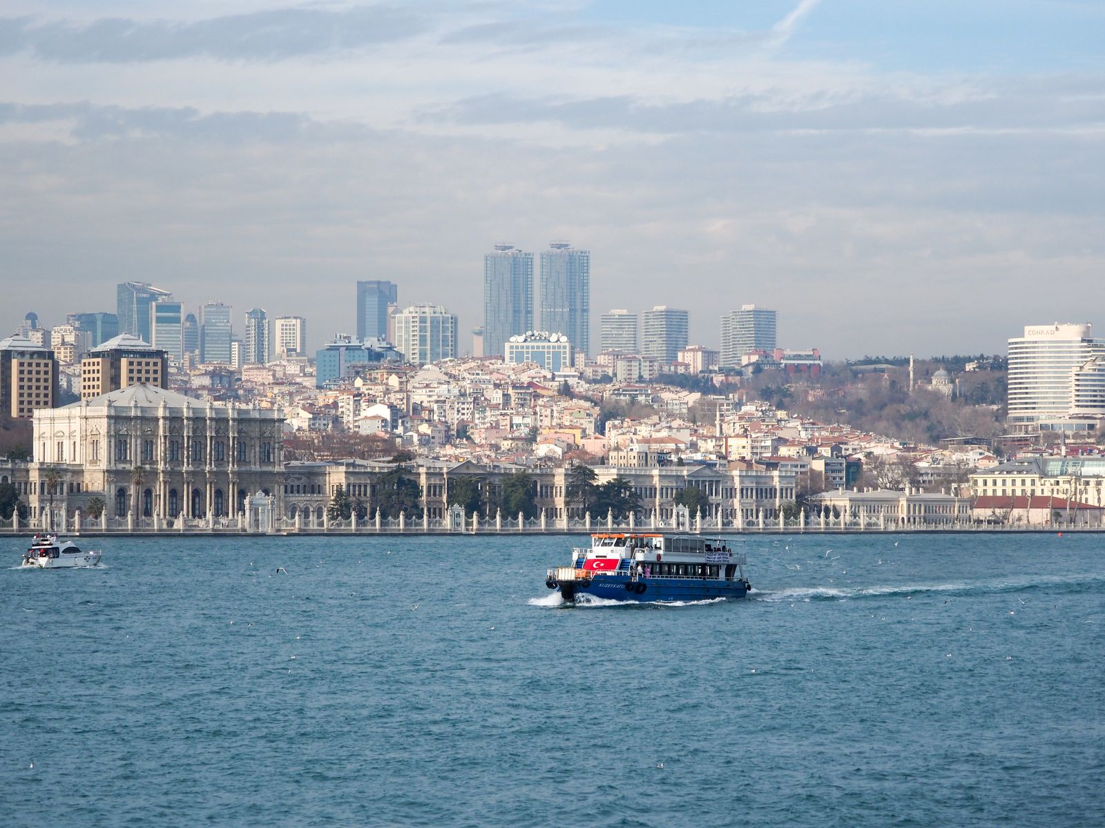 Bosphorus ferry and Istanbul business skyline
